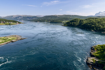 The dynamic Saltstraumen tide, captured from above, with its powerful whirlpools contrasting...
