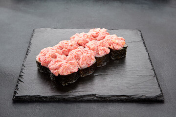 Roll topped with cream cheese and tobiko caviar; a creamy and crunchy sushi delight