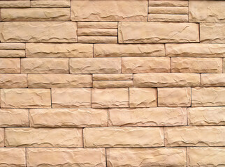 row of stack beige sandstone brick block textured, building exterior facade decor