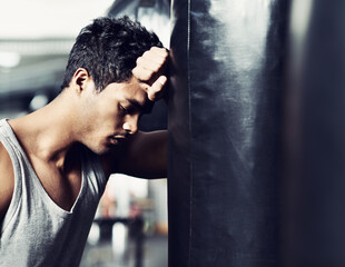 Fitness, punching bag or tired man at gym with low energy, loss or performance fail or mistake....