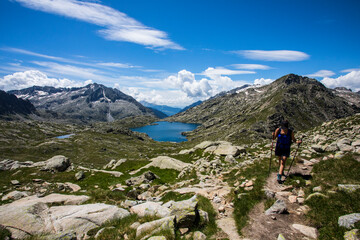 Fototapeta premium Young hiker girl summit to Montardo Peak in AIguestortes and Sant Maurici National Park, Spain