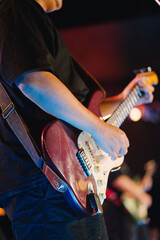 DJ Hands creating and regulating music on dj console mixer in concert outdoor. and guitar shows