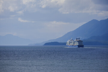 Breathtaking mountain glacier range view with luxury cruiseship cruise ship liner Solstice sailing...