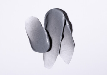 creamy texture of skincare cosmetics scrub mask peeling on a light background