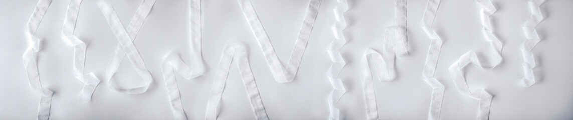 Collection of white tulle strips with shapes as decoration events - obrazy, fototapety, plakaty