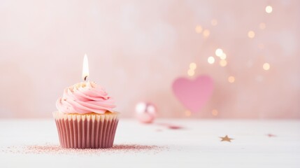 Birthday cupcake with one candle, a heart and a pink background