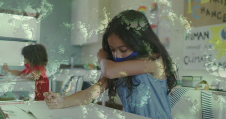 Fototapeta premium Image of coronavirus cells and schoolgirl in wearing face mask and coughing