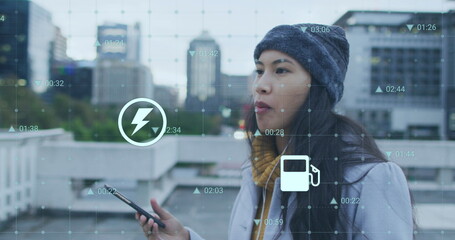 Image of data processing over biracial woman walking with smartphone