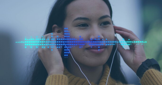 Image of data processing over biracial woman using earphones