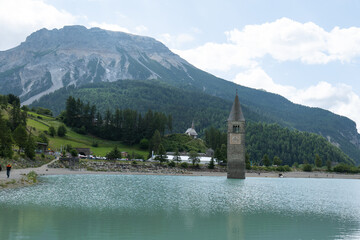 Submerged church in a mountain lake in Italy