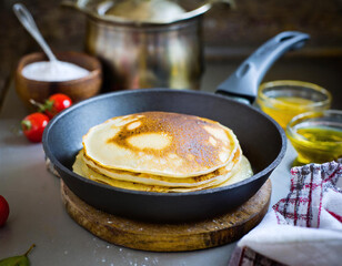 Pancake in Skillet with Melting Butter - Dark Kitchen Scene