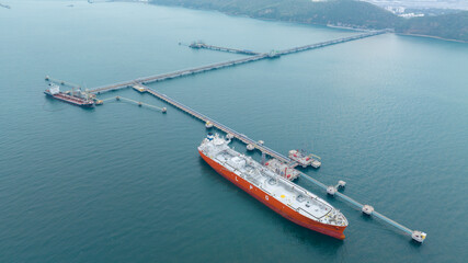LPG ship, Oil tanker ship. Red Oil Tanker ranchored in Gas terminal gas tanks for storage....