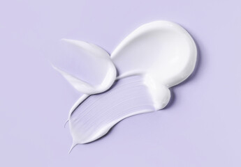 cosmetic smears cream texture on pastel background