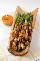 Calçots and its sauce. Typical meal from Catalonia, Spain. They are a type of green scallions.