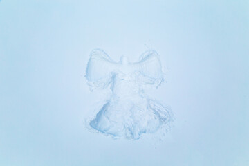 Snow angel on white snow.