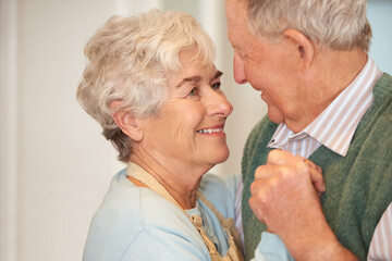 Elderly, couple and happy with dancing in home for bonding, support and holding hands with romance. Senior, man and woman with hug, embrace and smile for relationship, dancer and love with affection