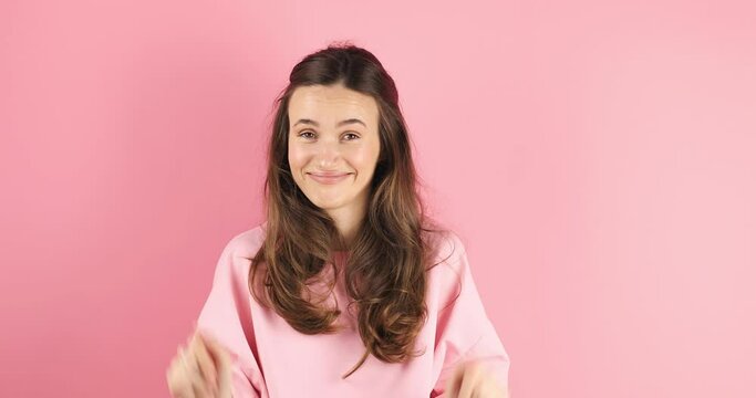Brunette woman looking camera pointing fingers herself ask me no i do not need it. Girl point on her, waving her hands and say no isolated on pink background.