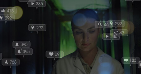 Image of falling icons over caucasian female server room worker