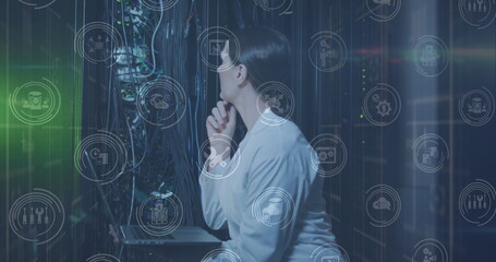 Image of falling icons over caucasian female server room worker
