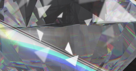 Image of white triangles over crystal