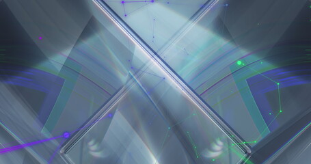 Image of blue and green shapes moving over cube
