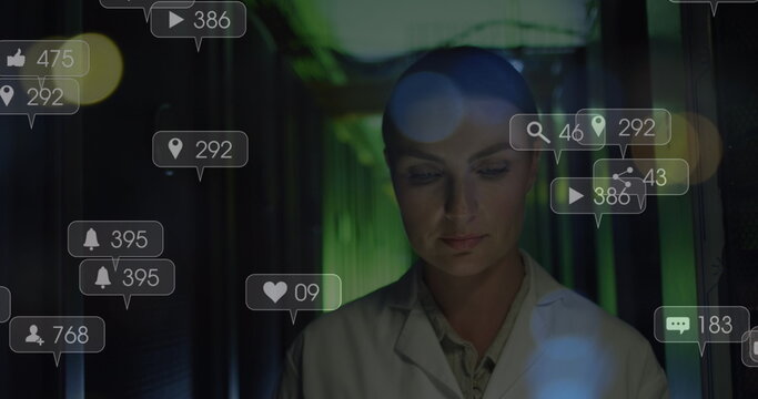 Image of falling icons over caucasian female server room worker