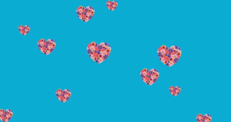 Image of flower hearts moving in hypnotic motion on blue background