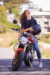 Woman, motorcycle and relax with helmet in city for ride, road trip or outdoor sightseeing in...