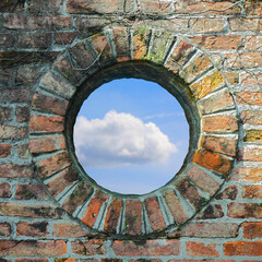 A round window where you see the sky - Cloudy sky view from the window - freedom concept image