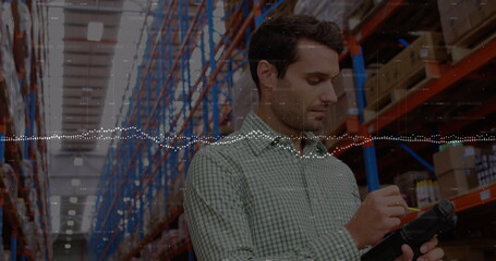 Image of financial data processing over caucasian businessman in warehouse