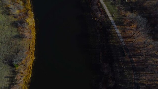 Autumn Overlook Aerial Views of Volga River, Forest, and the Grushinsky Festival Meadow in Warm Glow. Nature of Russia view from a drone in autumn