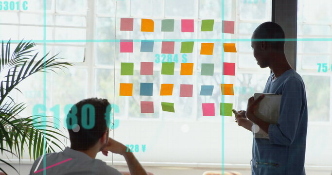 Image of data processing over disabled caucasian man with african american business colleague