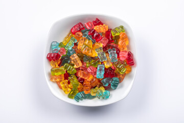 Sweet Delights: Colorful Gummibears in Assorted Flavors & Colors in White Bowl. Top View
