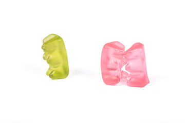 Sweet Love Triangle: Pink Gummibears Share a Kiss While a Green Gummybear is the Third Wheel