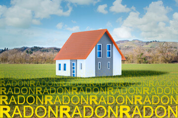 The danger of natural radon gas in our homes - concept with home model and radon gas rising from...