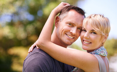 Naklejka premium Hug, smile or portrait of couple in nature with love, trust and support, security or solidarity outdoor. Happy, face and people embrace in a park for bonding, care or romantic date in London together