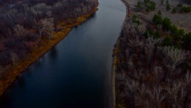 Autumn Overlook Aerial Views of Volga River, Forest, and the Grushinsky Festival Meadow in Warm Glow. Nature of Russia view from a drone in autumn