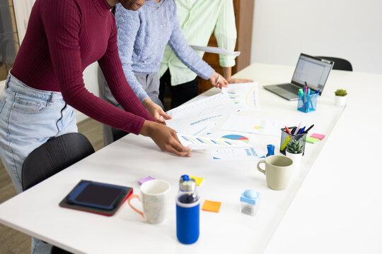 Analyzing business charts on a modern office desk