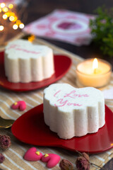 A heart shape ice-cream cake for lovers  wrote in text 