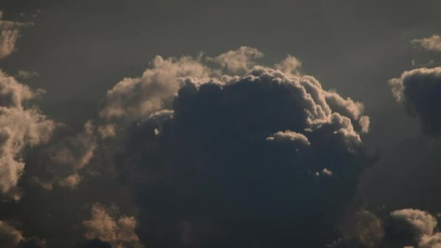 Flying Amongst Fluffy Dark Clouds