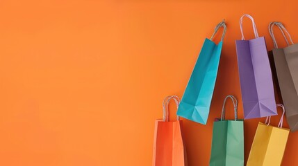  stack of shopping bag on orange background for copy space