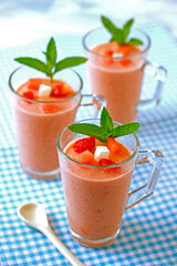 Watermelon smoothie with strawberries and coconut.
