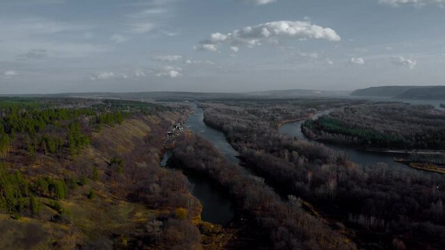 Autumn Overlook Aerial Views of Volga River, Forest, and the Grushinsky Festival Meadow in Warm Glow. Nature of Russia view from a drone in autumn