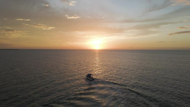 Aerial view of Progreso Beach at sunset with boat and motorboat, Yucatan, Mexico.