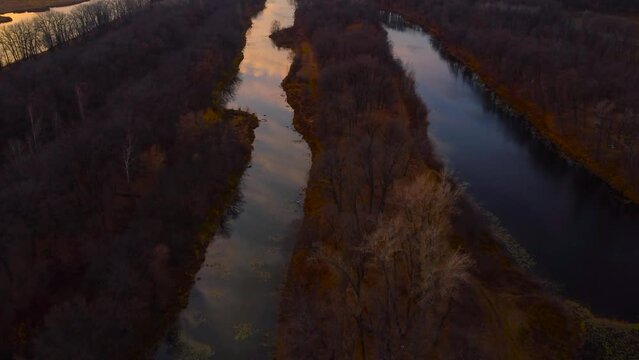 Autumn Overlook Aerial Views of Volga River, Forest, and the Grushinsky Festival Meadow in Warm Glow. Nature of Russia view from a drone in autumn