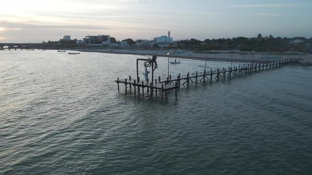 Aerial view of Progreso Beach with beautiful ocean waves and tranquil palm trees, Yucatan, Mexico.