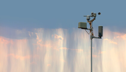 Weather station automatic measurement of weather parameters with Stormy sky - obrazy, fototapety, plakaty
