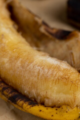 an overripe dark banana that is spoiling