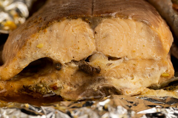 red trout fried in foil with spices, close-up