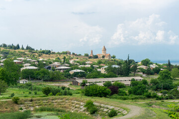 Tibaani village, Church of Khirsa monastery of Saint Stephen and bell tower. Artificial lake, roofs...
